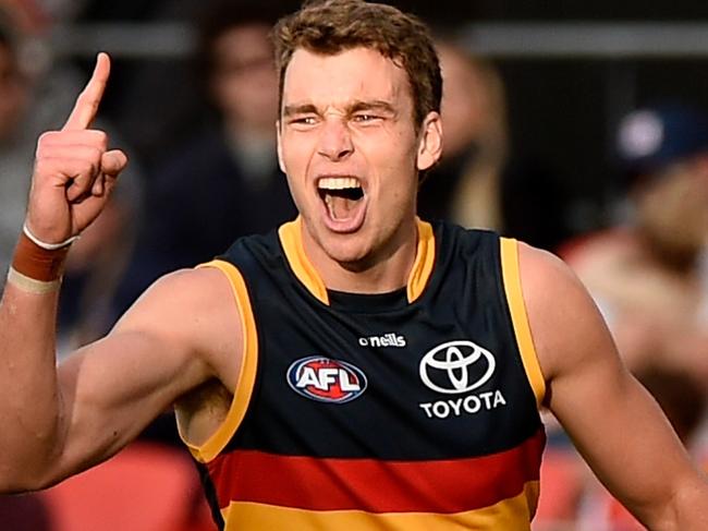 GOLD COAST, AUSTRALIA - JUNE 19: Riley Thilthorpe of the Crows celebrates kicking a goal during the round 14 AFL match between the Gold Coast Suns and the Adelaide Crows at Metricon Stadium on June 19, 2022 in Gold Coast, Australia. (Photo by Matt Roberts/AFL Photos/Getty Images)