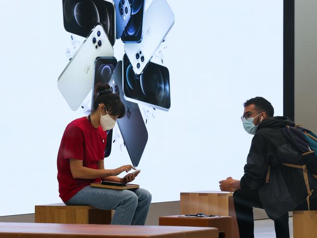 SYDNEY, AUSTRALIA - NewsWire Photos DECEMBER 08 2020: Customers seen shopping inside the Apple Store in the CBD in Sydney Australia. Picture: NCA NewsWire / Gaye Gerard