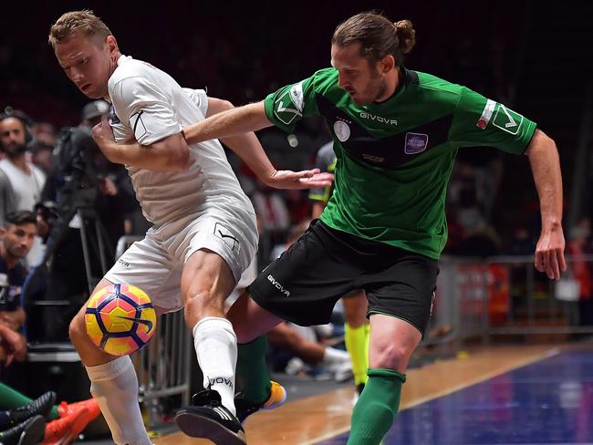 Socceroos Legend’s Jon McKain (right) challenges Liverpool Legend’s Jan Kromkamp for the ball.