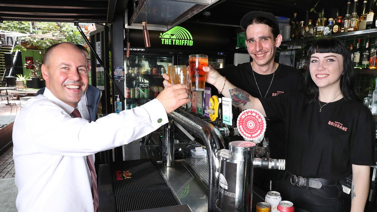 Treasurer Josh Frydenberg shares a drink with Triffid bar staff Dylan Gatt and Hayley Sherriff, Newstead. Photographer: Liam Kidston.