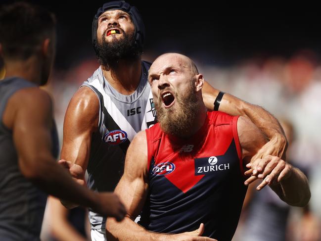 Paddy Ryder and Max Gawn at a ruck contest.