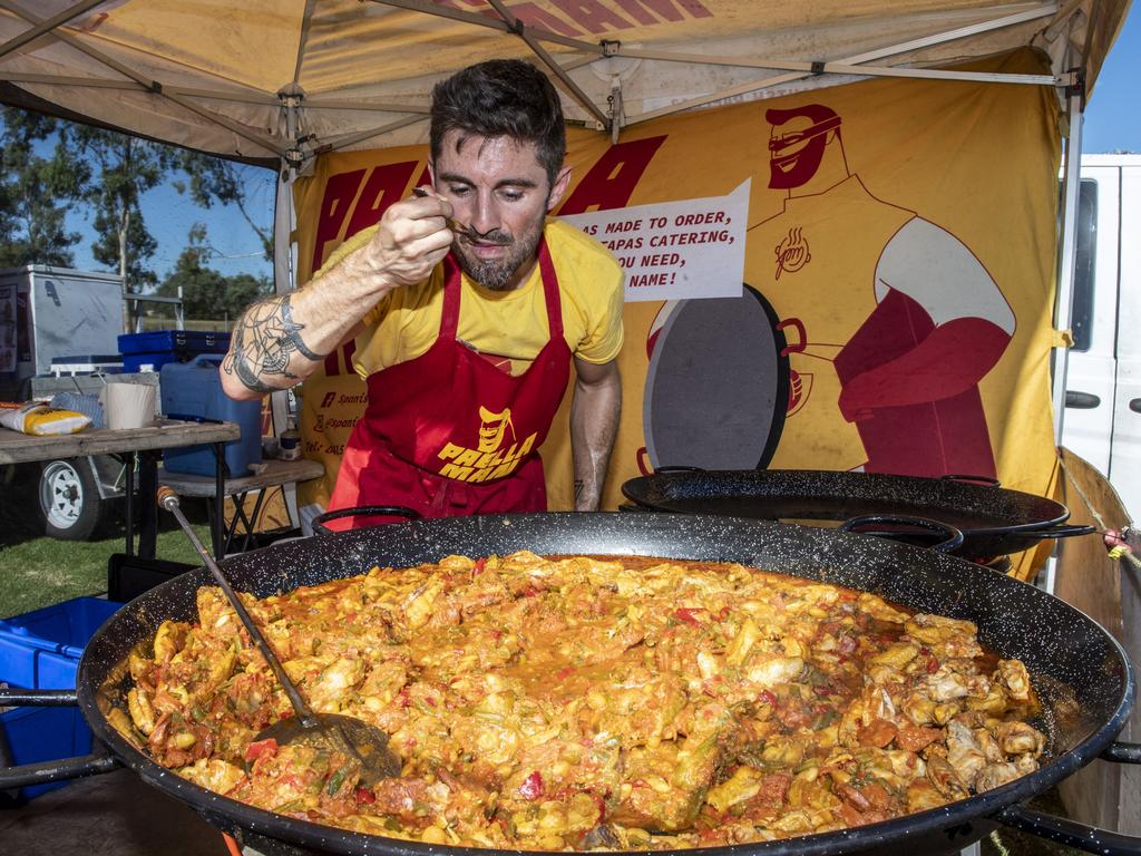 Alex Saporta the "Paella Man" creates a taste sensation in a dish at the Toowoomba Street Food Festival at Pittsworth. Saturday, January 29, 2022. Picture: Nev Madsen.