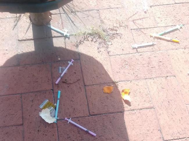 Needles left discarded near a Maryborough bin.