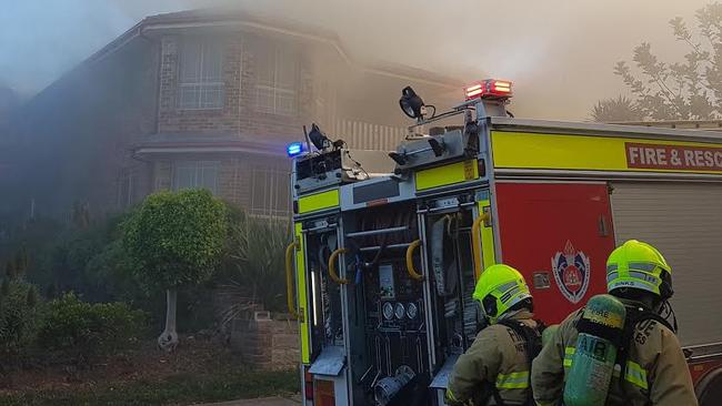 Fire crews battle the fire at the house. Picture: Glen Coker