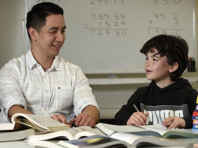 Ryan Ou, owner and tutor at Bayside Academics in Brighton, with student Jackson Bartlett, 8. Picture: Andrew Henshaw
