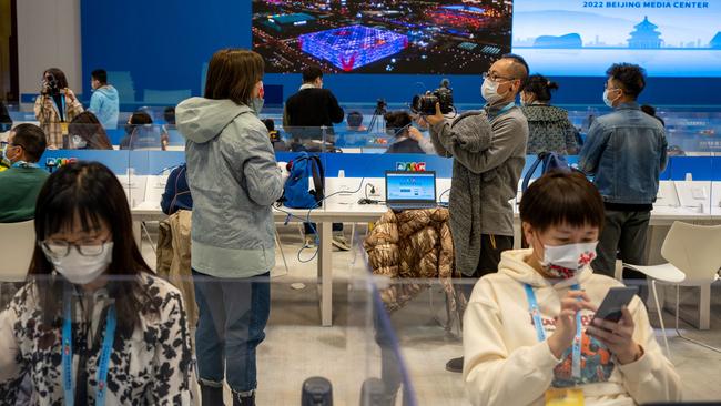 Reporters work during the opening ceremony of the Beijing 2022 Winter Olympic Games. Picture: AFP