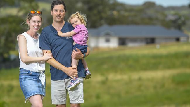 Mount Barker family Krystal, Maeve and Jeffery O’Connell at the end of their street. Their neighbourhood is surrounded by new developments. Picture: Roy VanDerVegt.