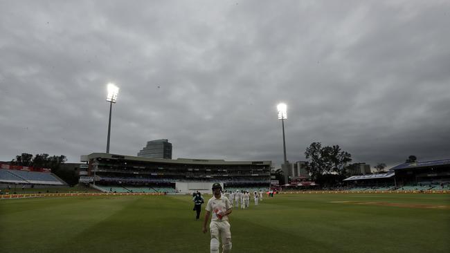 Australia's batsman Mitchell Marsh leaves the field as match delayed by bad light on day one of the first cricket test match between South Africa and Australia at Kingsmead stadium in Durban, South Africa, Thursday, March 1, 2018. (AP Photo/Themba Hadebe)