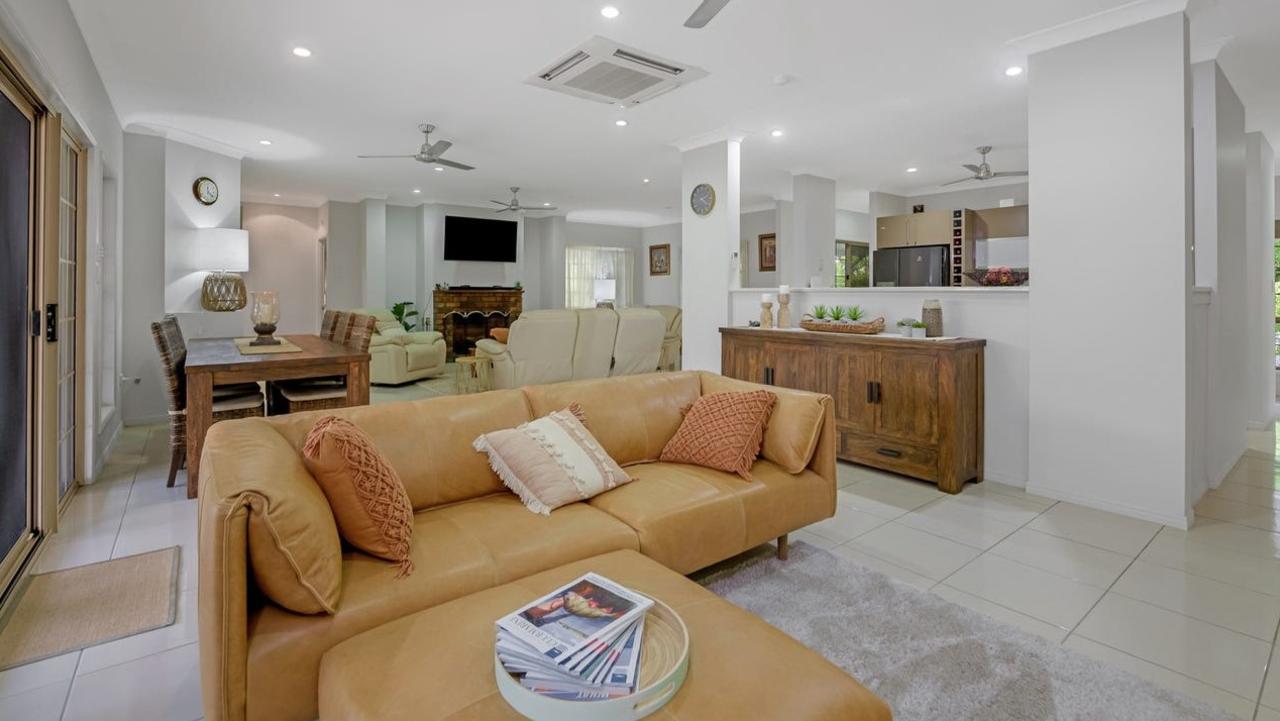 The home has an open plan kitchen, living and dining area that opens to a large undercover entertainment area. Picture: realestate.com.au