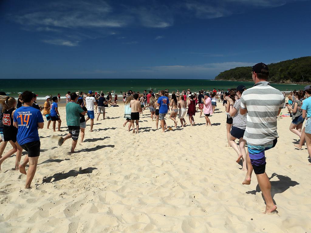 A flash mob gathers at Noosa’s main beach. Picture: Glenn Barnes