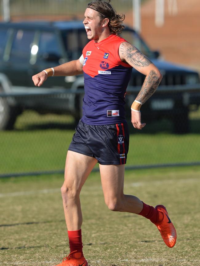 Mt Eliza’s Jimmy Freeman celebrates a Redlegs goal. Picture: Chris Eastman