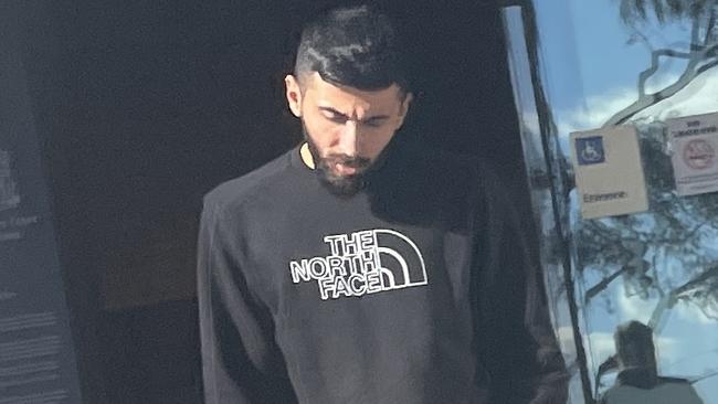 Hassan Abadi, 24, leaves Broadmeadows Magistrates' Court on Tuesday, after pleading guilty to possessing a prohibited weapon, drugs and driving unlicensed.