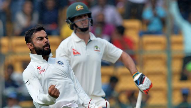 Indian cricket team captain Virat Kohli celebrates after the dismissal of Australian batsman Mitchell Marsh.