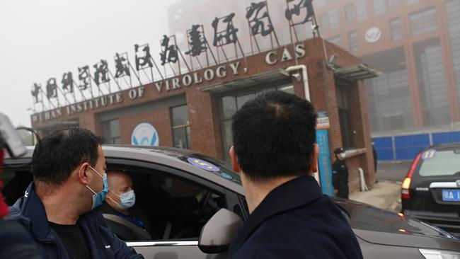 Members of a World Health Organisation team investigating the origins of Covid-19 arrive at the Wuhan Institute of Virologyin February. Picture: AFP