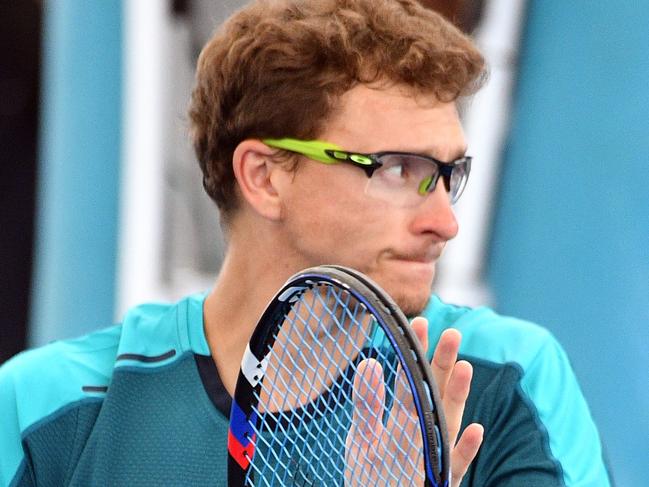 Denis Istomin of Uzbekistan celebrates his victory over Jared Donaldson of the US during their men's singles second round match at the Brisbane International tennis tournament at the Pat Rafter Arena in Brisbane on January 4, 2018. / AFP PHOTO / SAEED KHAN / IMAGE RESTRICTED TO EDITORIAL USE – STRICTLY NO COMMERCIAL USE