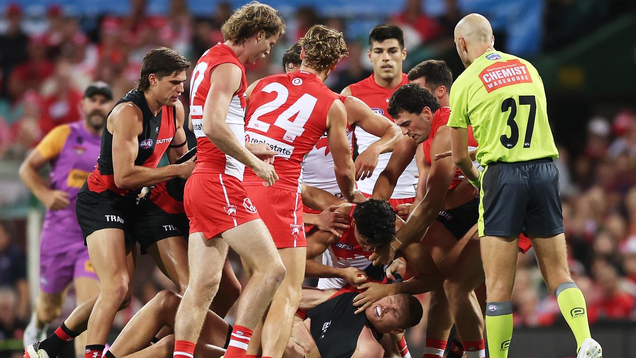 The players ended up in a melee after the heavy hit. (Photo by Matt King/AFL Photos/via Getty Images )