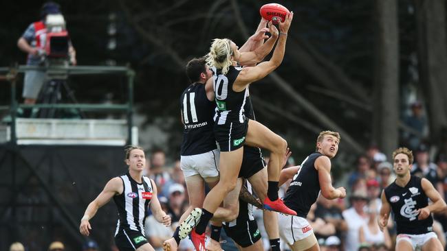 Darcy Moore takes a big mark against the Blues in the final JLT Series match.