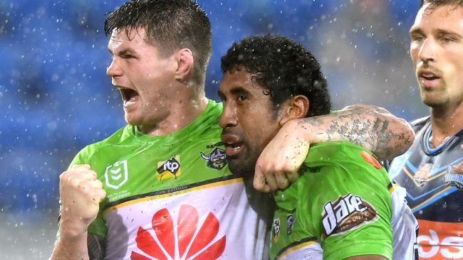 GOLD COAST, AUSTRALIA - MARCH 17: Iosia Soliola of the Raiders is congratulated by team mates after scoring a try during the round 1 NRL match between the Gold Coast Titans and the Canberra Raiders at Cbus Super Stadium on March 17, 2019 in Gold Coast, Australia. (Photo by Bradley Kanaris/Getty Images)