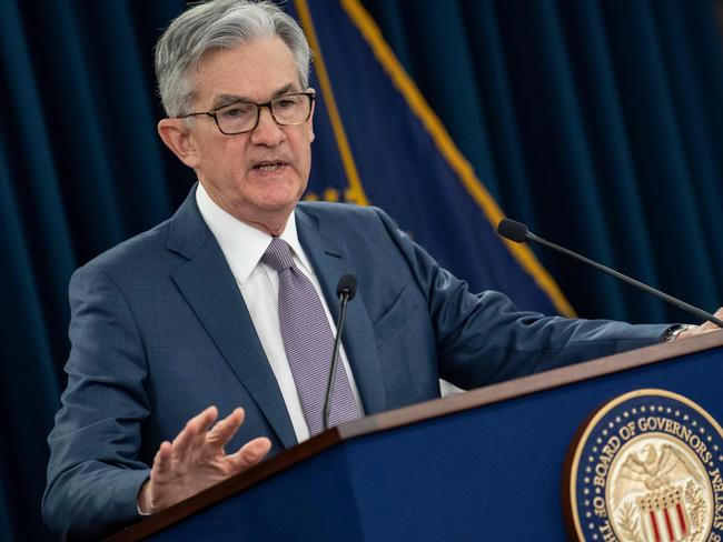 (FILES) In this file photo taken on March 03, 2020 US Federal Reserve Chairman Jerome Powell gives a press briefing after the surprise announcement the FED will cut interest rates in Washington,DC. - The US central bank opened a two-day policy meeting on July 28, 2020, amid signs of waning consumer confidence and with Congress locked in debate over how best to support the economy amid the pandemic. (Photo by Eric BARADAT / AFP)