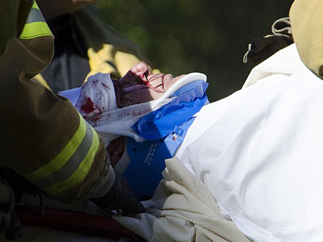 Injured ... Star Wars actor Harrison Ford with paramedics after crashing his 1930’s vintage plane on the Penmar golf course in Venice California. Picture: Snapper Media Group