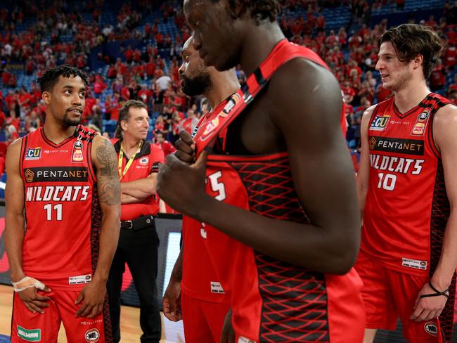 Kyle Bowen (right) with Bryce Cotton, Terrico White and Wani Swaka Lo Buluk during the NBL19 grand final series. Picture: AAP Image