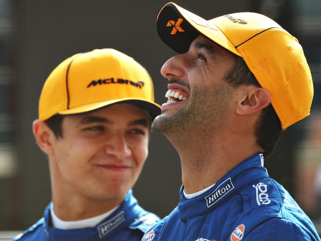 BAHRAIN, BAHRAIN - MARCH 12: Daniel Ricciardo of Australia and McLaren F1 and Lando Norris of Great Britain and McLaren F1 look on from the grid during Day One of F1 Testing at Bahrain International Circuit on March 12, 2021 in Bahrain, Bahrain. (Photo by Joe Portlock/Getty Images)