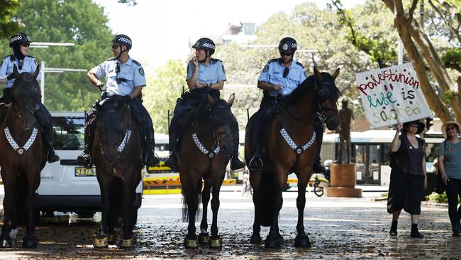 Police officers waiting for the protest to start in Hyde Park in the Sydney CBD on Sunday. Picture: Jonathan Ng