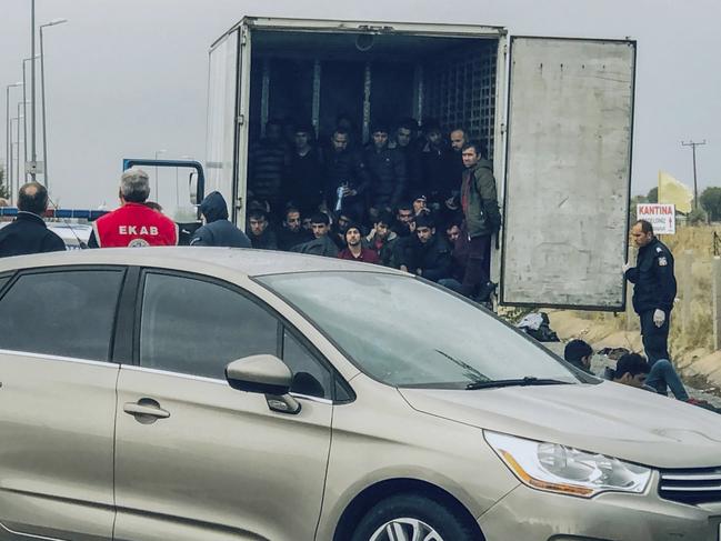 Migrants are seen inside a truck found by police, near the town of Xanthi, Greece. Picture: AP