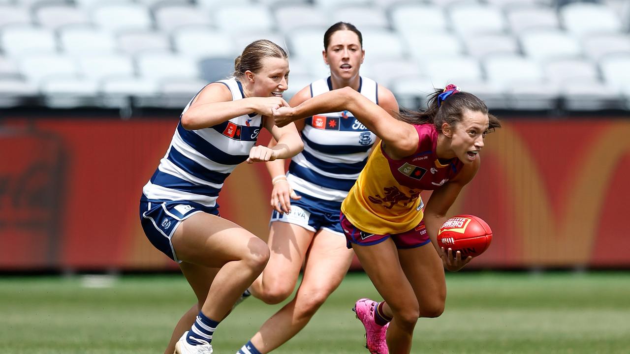 Geelong’s Chantal Mason closes in on Lions’ opponent Jade Ellenger on Sunday. Picture: Michael Willson/AFL Photos via Getty Images