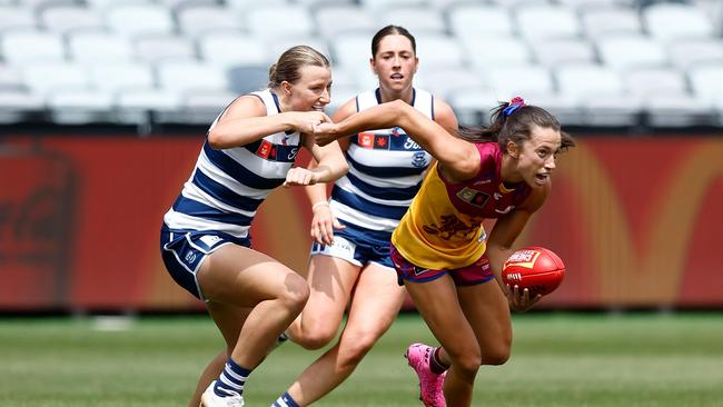 Geelong’s Chantal Mason closes in on Lions’ opponent Jade Ellenger on Sunday. Picture: Michael Willson/AFL Photos via Getty Images