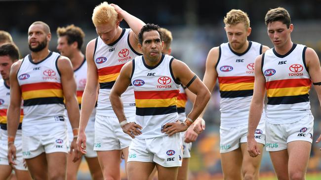 The Crows leave the field after the one-point loss to Brisbane. Picture: AAP Image/Darren England