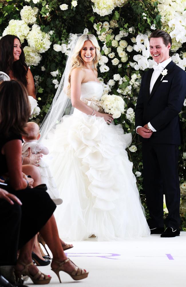 Roxy Jacenko and Oliver Curtis watch their baby daughter Pixie-Rose during their 2012 marriage ceremony in Sydney.