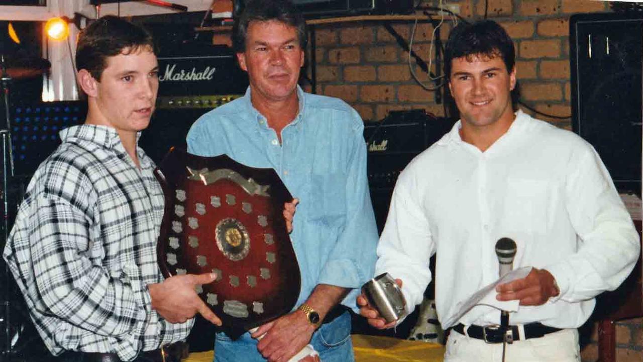 Parramatta Eels' coach Brad Arthur (right) presents a young Adam O’Brien with a best and fairest award.