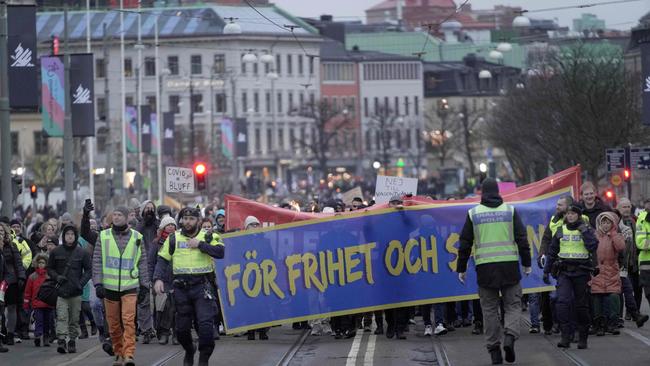 Protesters take part in a march under the motto "For a free Sweden without vaccine pass" in Stockholm. Photo: AFP.