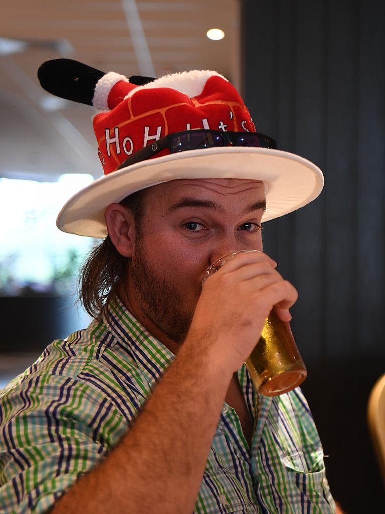 Mitchell Brushett downs a cold one at Christmas lunch at Silks. Picture: (A)manda Parkinson