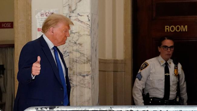 Donald Trump gives a thumbs up during a break in New York civil fraud trial on Wednesday Picture: AFP