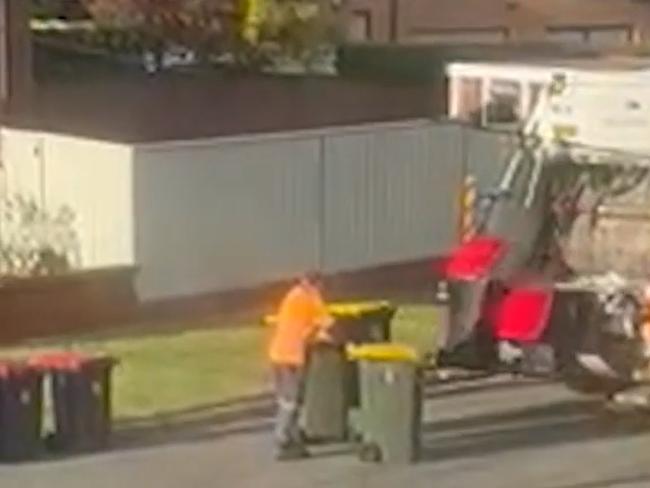 You can see council workers emptying both bins in the truck. Source: Pia Coyle via The Sydney Morning Herald