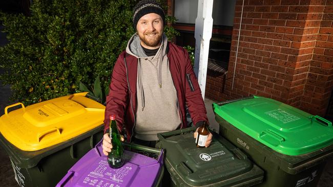 The purple-lidded bin is for glass products only. Picture: Mark Stewart/ NCA Newswire