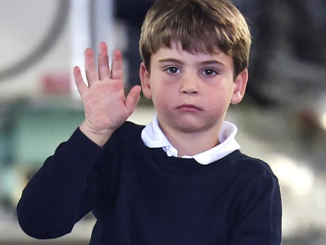 FAIRFORD, ENGLAND - JULY 14: Prince Louis of Wales waves as he sits inside a vehicle on a C17 plane during a visit to the Air Tattoo at RAF Fairford on July 14, 2023 in Fairford, England. The Prince and Princess of Wales have a strong relationship with the RAF, with the Prince having served with the Search and Rescue Force for over three years, based at RAF Valley in Anglesey. The Prince is Honorary Air Commodore of RAF Coningsby and The Princess is Honorary Air Commodore of the Air Cadets. (Photo by Chris Jackson/Getty Images)