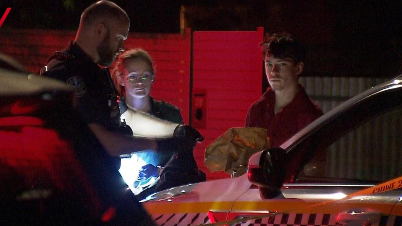 Ashra Stuart with police after the stabbing at Campbelltown. Picture: 7NEWS