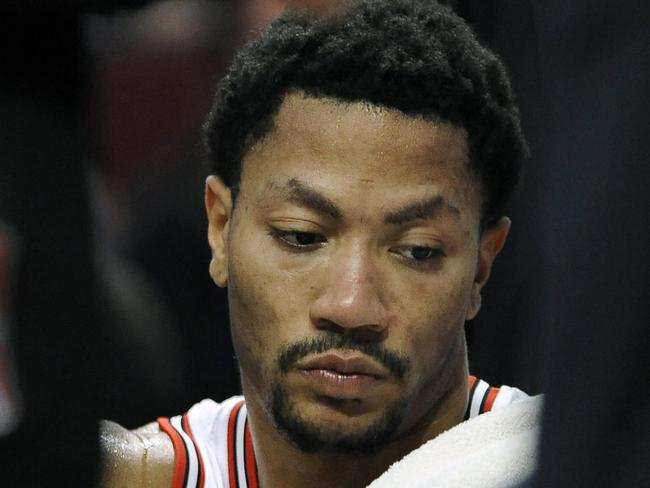 Chicago Bulls' Derrick Rose sits on the bench during the second half of an NBA basketball game against the Cleveland Cavaliers in Chicago, Friday, Oct. 31, 2014. Cleveland won 114-108 in overtime. (AP Photo/Paul Beaty)