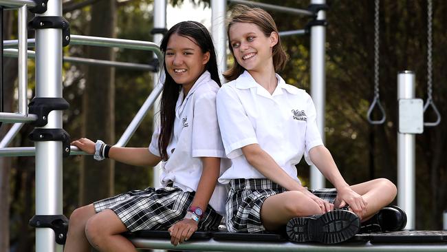 Sydney students Mika Shapley, 13, left, and Amelie Lehmann, 12, say they have found it easy to fit in but understand how others struggle. Picture: Jane Dempster