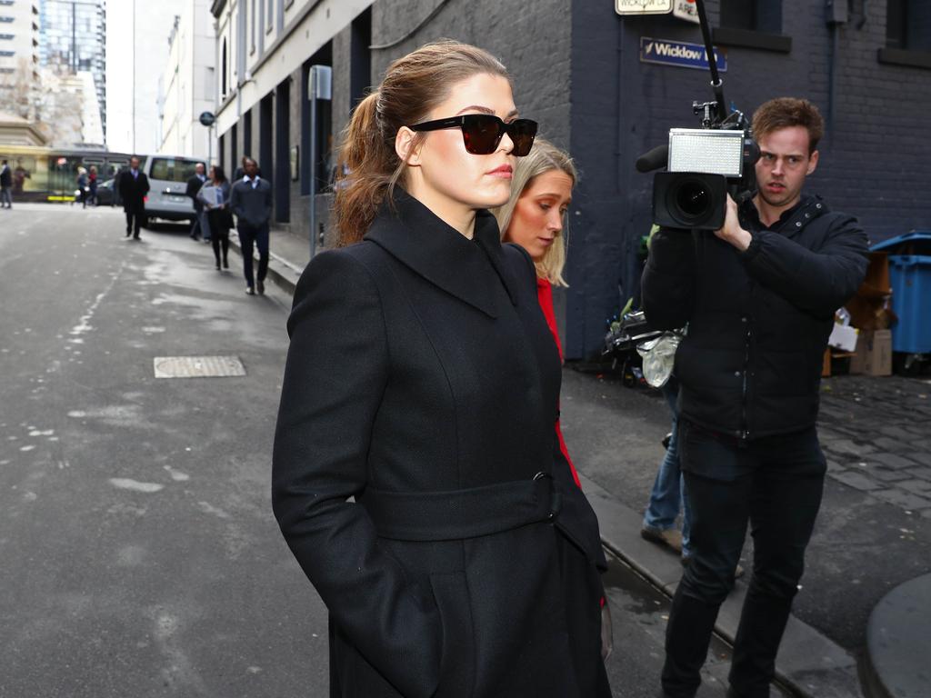 Belle Gibson leaves the federal court in Melbourne in 2019 flanked by her legal team. Picture: Aaron Francis/The Australian