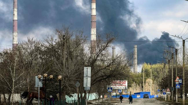 Smoke rises from a power plant after shelling outside the town of Schastia, near the eastern Ukraine city of Lugansk.