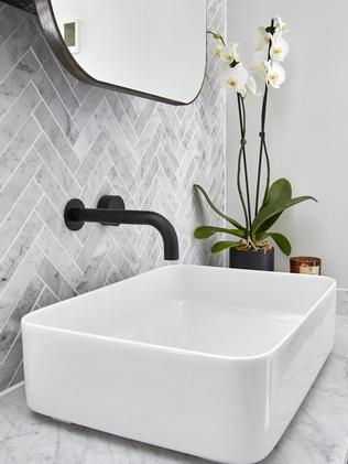 White basins, black taps and herringbone backdrop gave it a luxe feel. Picture: The Block