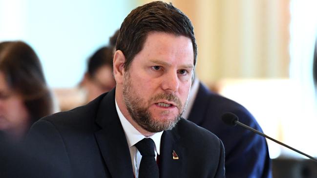 Director-General of the Department of Innovation, Tourism Industry Development and the Commonwealth Games, Damien Walker,  answers questions during a budget estimates committee hearing at Parliament House in Brisbane, Wednesday, August 1, 2018. (AAP Image/Dan Peled) NO ARCHIVING