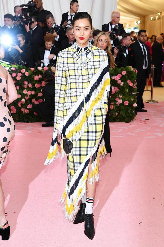 Liu Wen wears Thom Browne at the 2019 Met Gala.