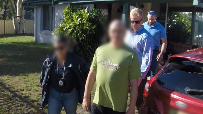 Detectives from the State Crime Command’s Sex Crimes Squad arrest Jason Bishop at Tanilba Bay last year following an investigation into online grooming. Picture: NSW Police. i