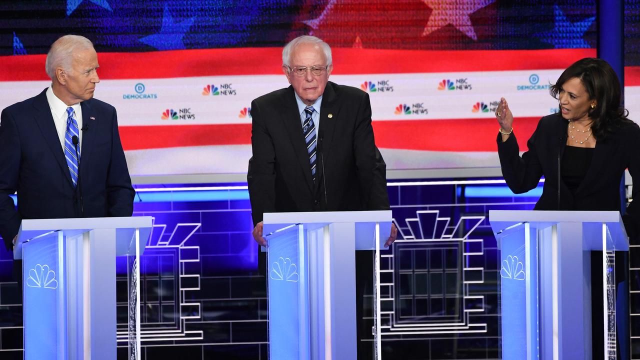 That’s Kamala Harris on the right, Joe Biden on the left, and Bernie Sanders standing awkwardly in the crossfire. Picture: AFP/Saul Loeb