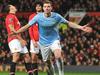 (Files) In this file picture taken on March 25, 2014, Manchester City's Bosnian forward Edin Dzeko celebrates after scoring the second goal during the English Premier League football match against Manchester United at Old Trafford in Manchester. Manchester City striker Edin Dzeko on Wednesday, August 20, 2014, signed a new four-year contract which will keep him at the Premier League champions until at least 2018. The Bosnian international's current deal had only 10 months to run and manager Manuel Pellegrini's determination to keep the striker was fully justified by his performance as City beat Newcastle 2-0 on Sunday. AFP PHOTO/PAUL ELLIS RESTRICTED TO EDITORIAL USE. No use with unauthorized audio, video, data, fixture lists, club/league logos or “live” services. Online in-match use limited to 45 images, no video emulation. No use in betting, games or single club/league/player publications.